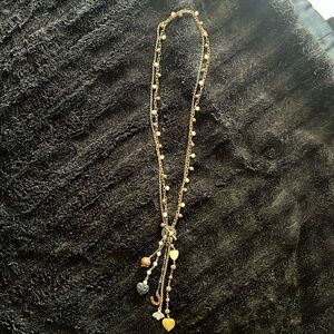 Long bronze, gold and pearl necklace with charms